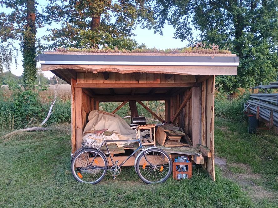 Sixth Shelter Construction Weekend: Shelter with bike